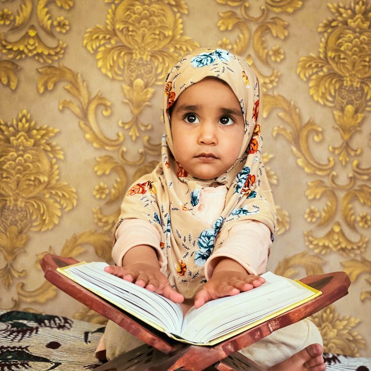 Child learning Quran